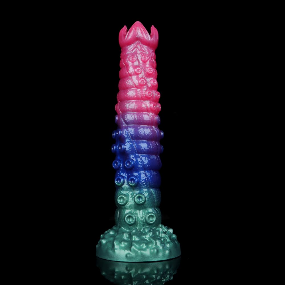 Vertical front view of the tri-color monster ovipositor dildo showcasing the pink, purple, and green gradient with ribbed alien pod textures and a strong suction cup base.