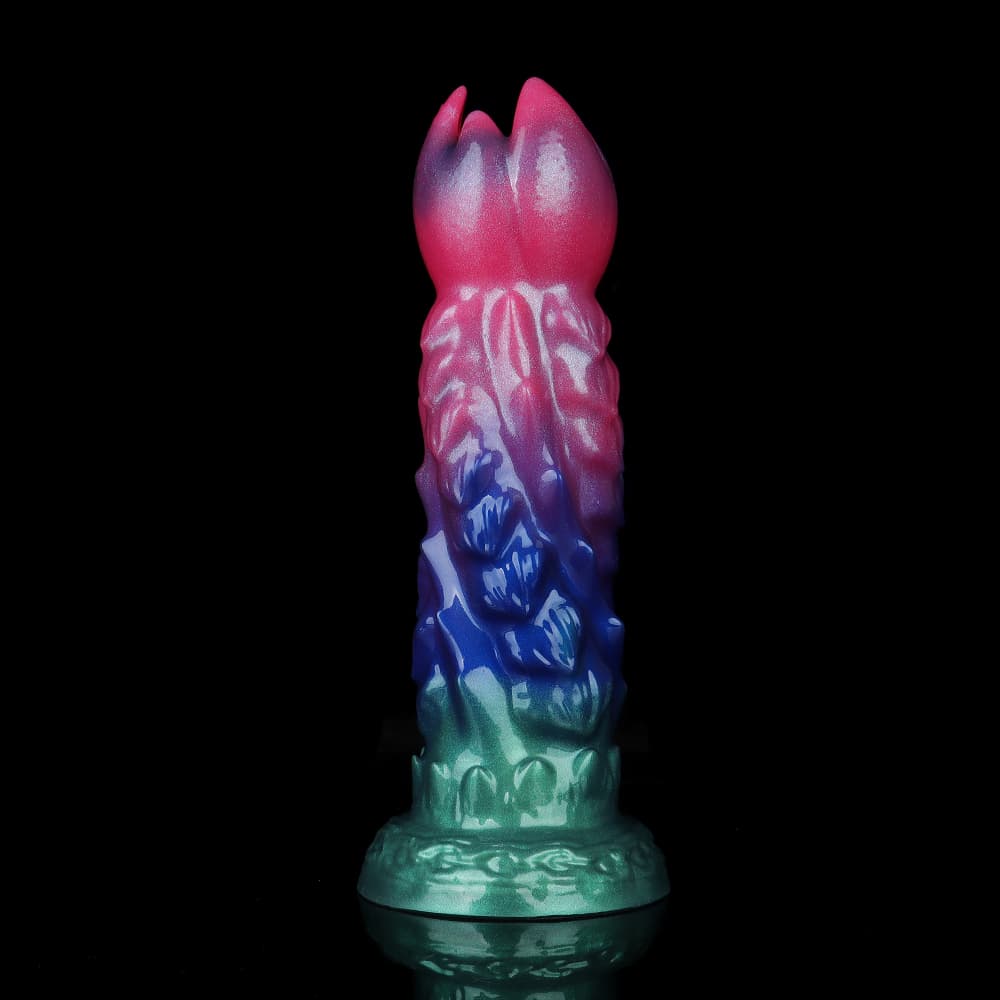 Front view of the vertical Alien Queen fantasy ovipositor dildo showing the detailed dragon scale texture on the silicone shaft and the blooming petal-shaped tip opening.