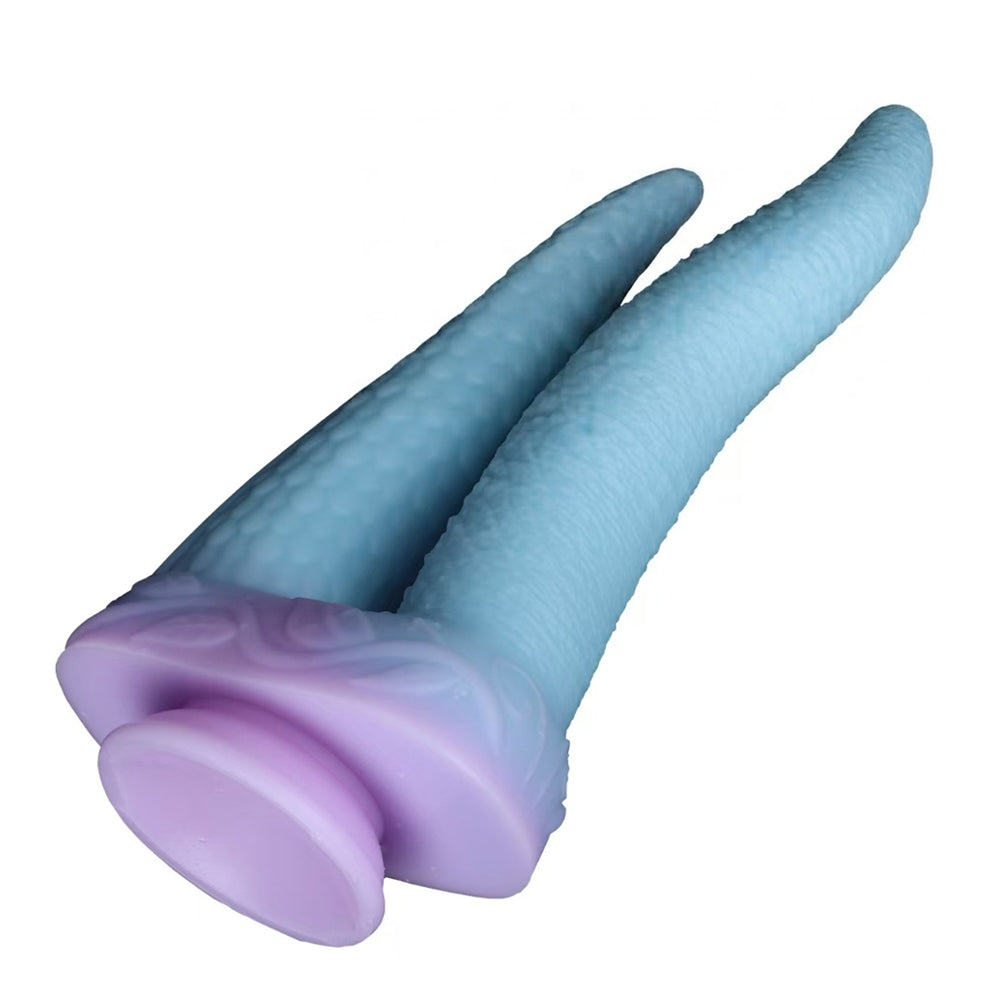 Bottom view of the mythical beast fantasy dildo highlighting the large purple powerful suction cup base for hands-free play.