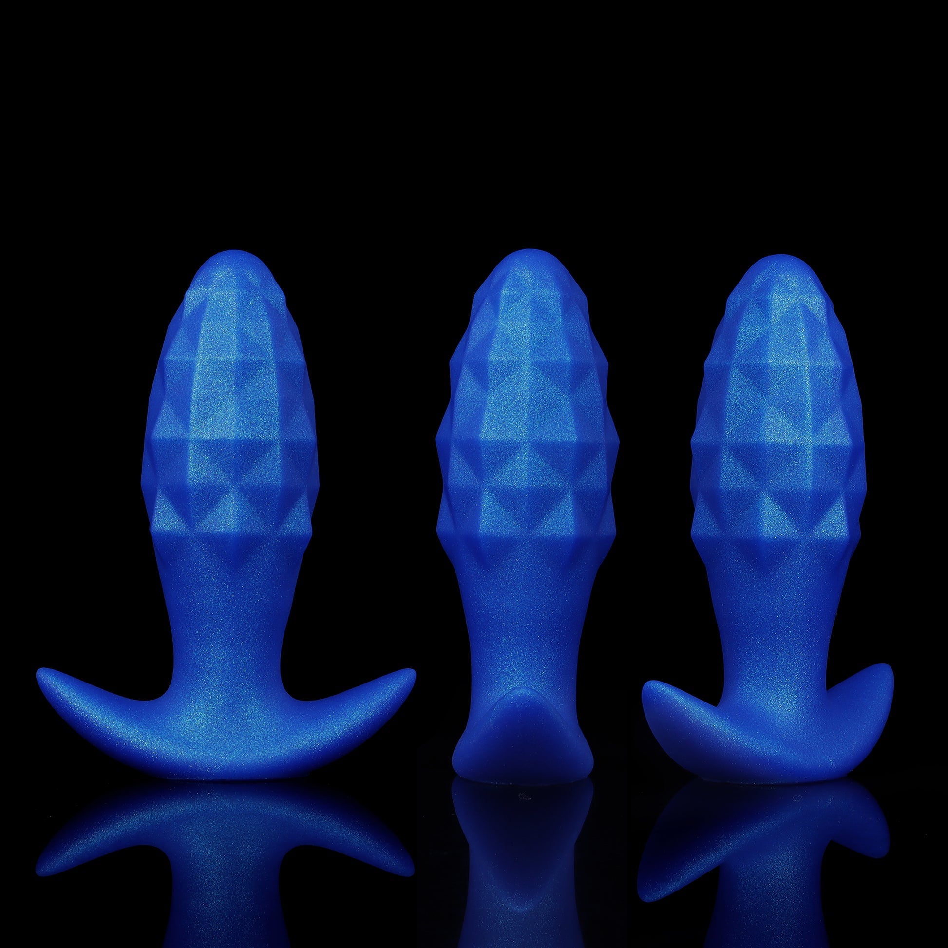 Three shimmering blue inflatable silicone plugs displayed side-by-side from the front, side, and angled views to show the diamond geometric facets.