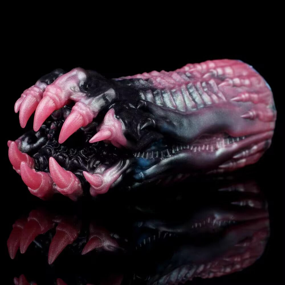 Front view of the G6252 model fantasy adult toy, focusing on the sharp pink mythical beast claws surrounding a highly textured internal entry tunnel with organic sensory nodes.