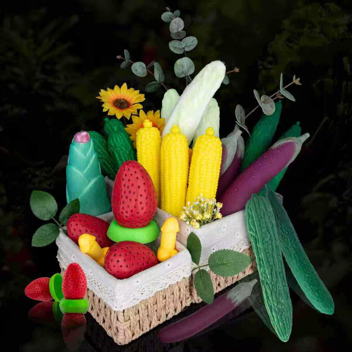 Collection of vegetable and fruit silicone dildos and butt plugs including corn, eggplant, strawberry, and cucumber.