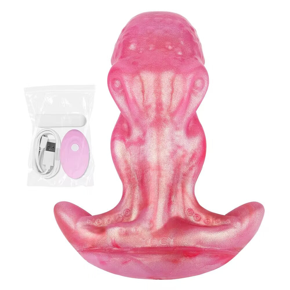 Pink octopus fantasy plug displayed alongside rechargeable wireless remote control and USB charging cable.