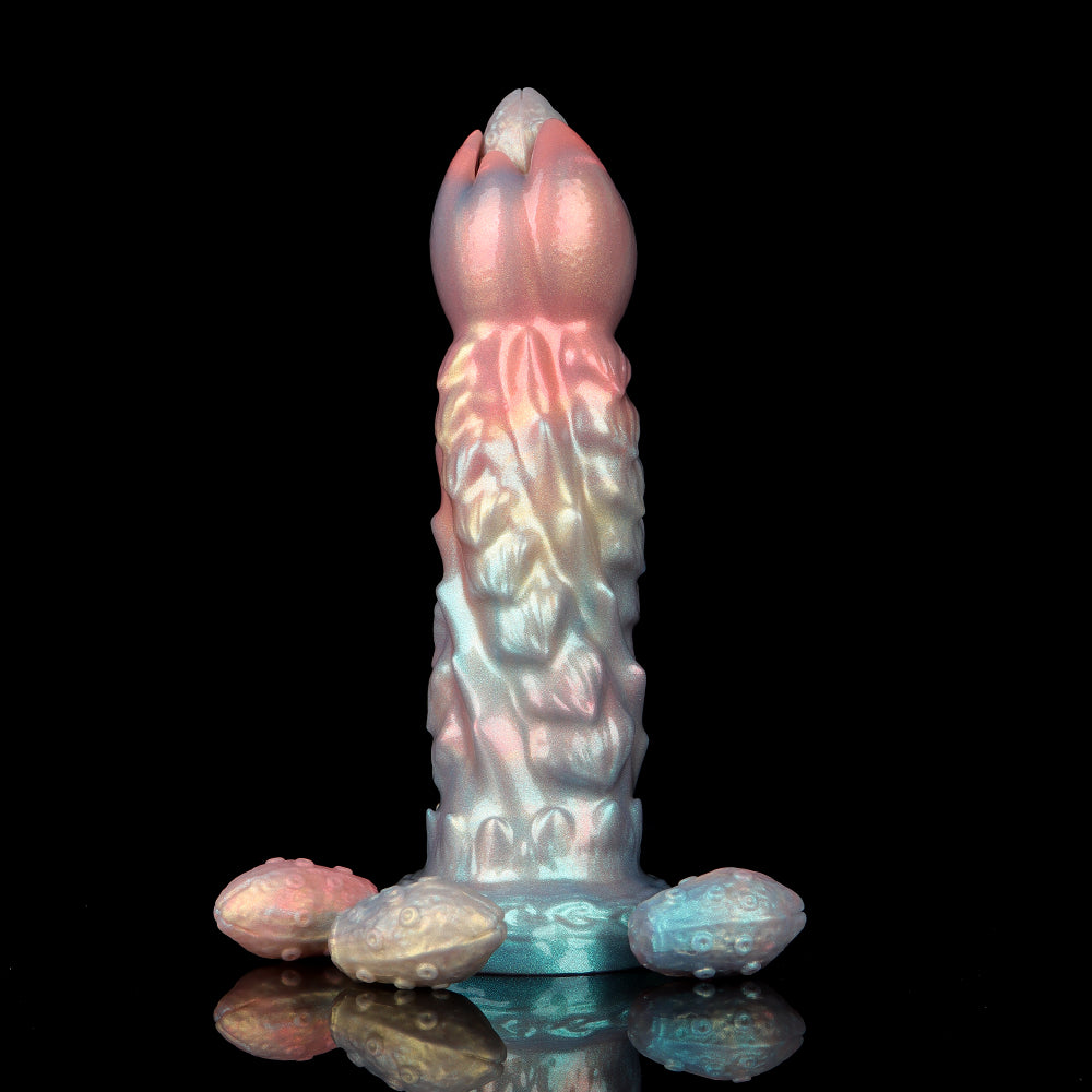 Standing iridescent pastel-colored monster fantasy dildo with three detailed silicone monster pods arranged around its thick suction cup base on a glossy black surface.