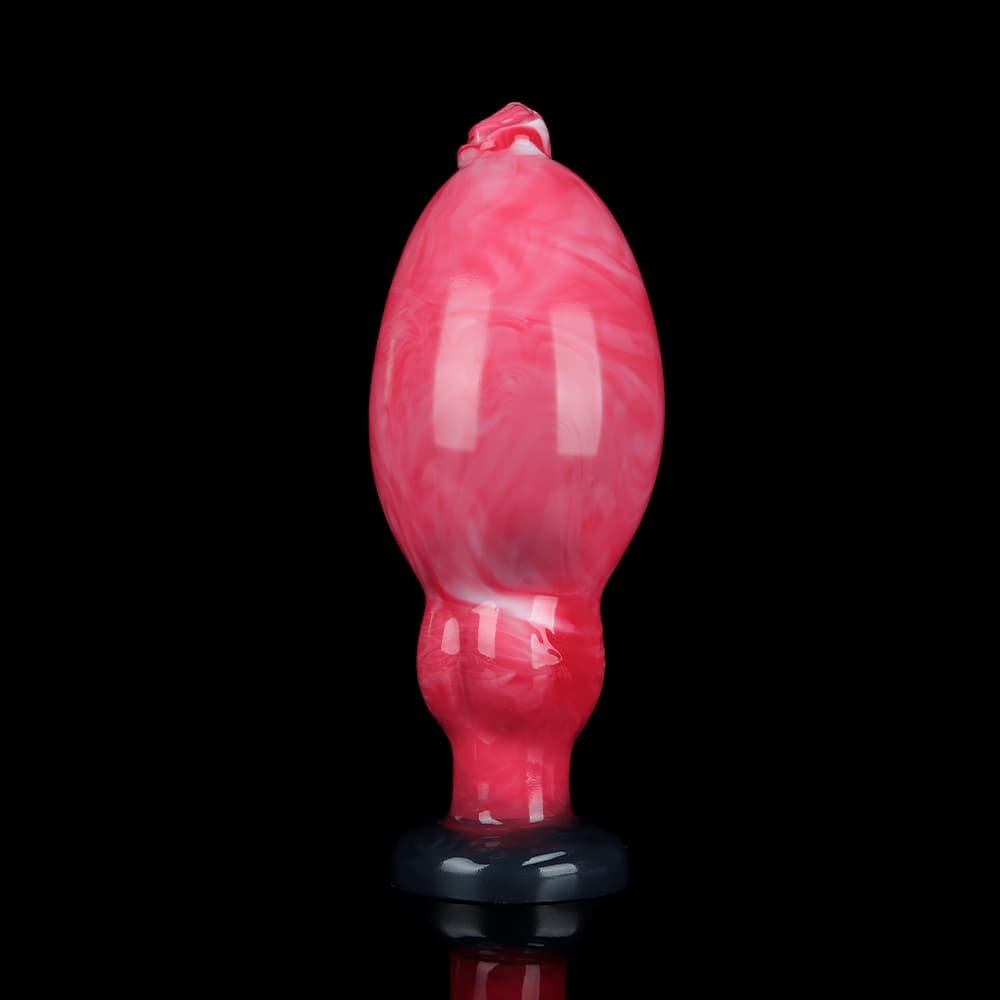 Front view of a premium pink marble inflatable silicone butt plug with a dark suction cup base on a black background.