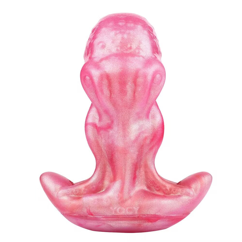 Front view of pink shimmering octopus tentacle fantasy plug showing textured contours and wide anchor base for secure wear.