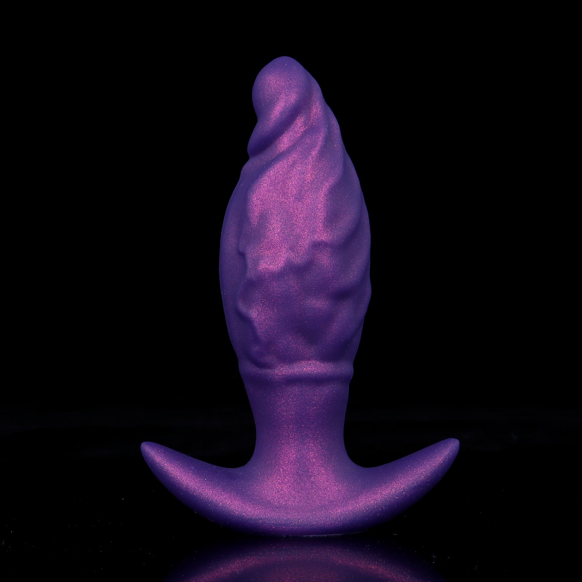 Electric purple premium silicone inflatable butt plug with elegant flame-inspired wave ridges, designed for maximum internal friction and backdoor pleasure.