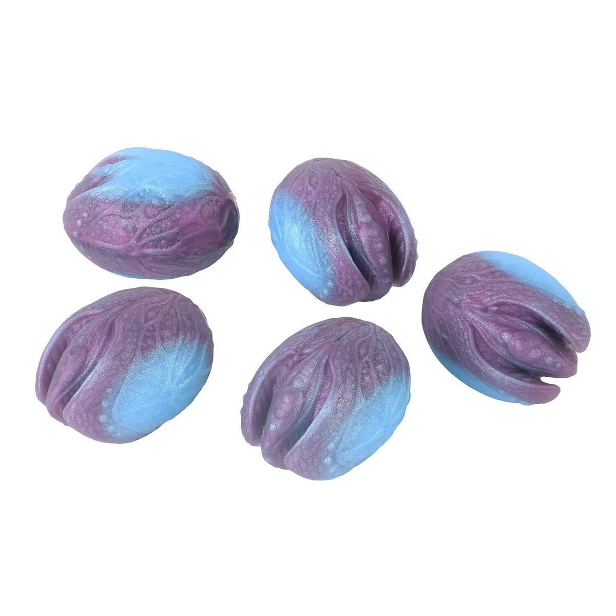 Close up textured purple and blue gradient silicone mystic egg beads.