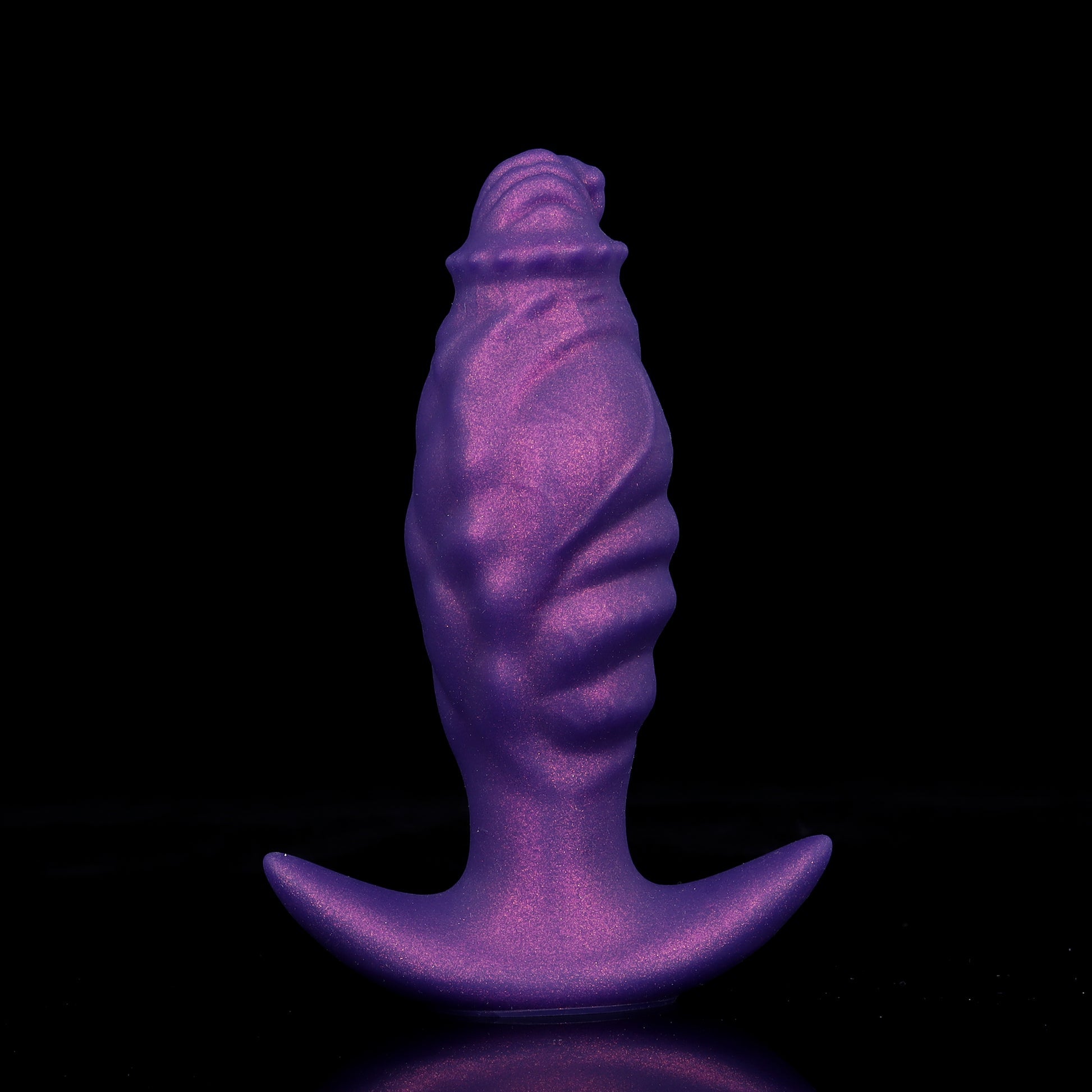 Front view of a deflated purple fantasy tentacle anal plug standing upright, showcasing deep cosmic ripple textures and a wide flared anchor base.