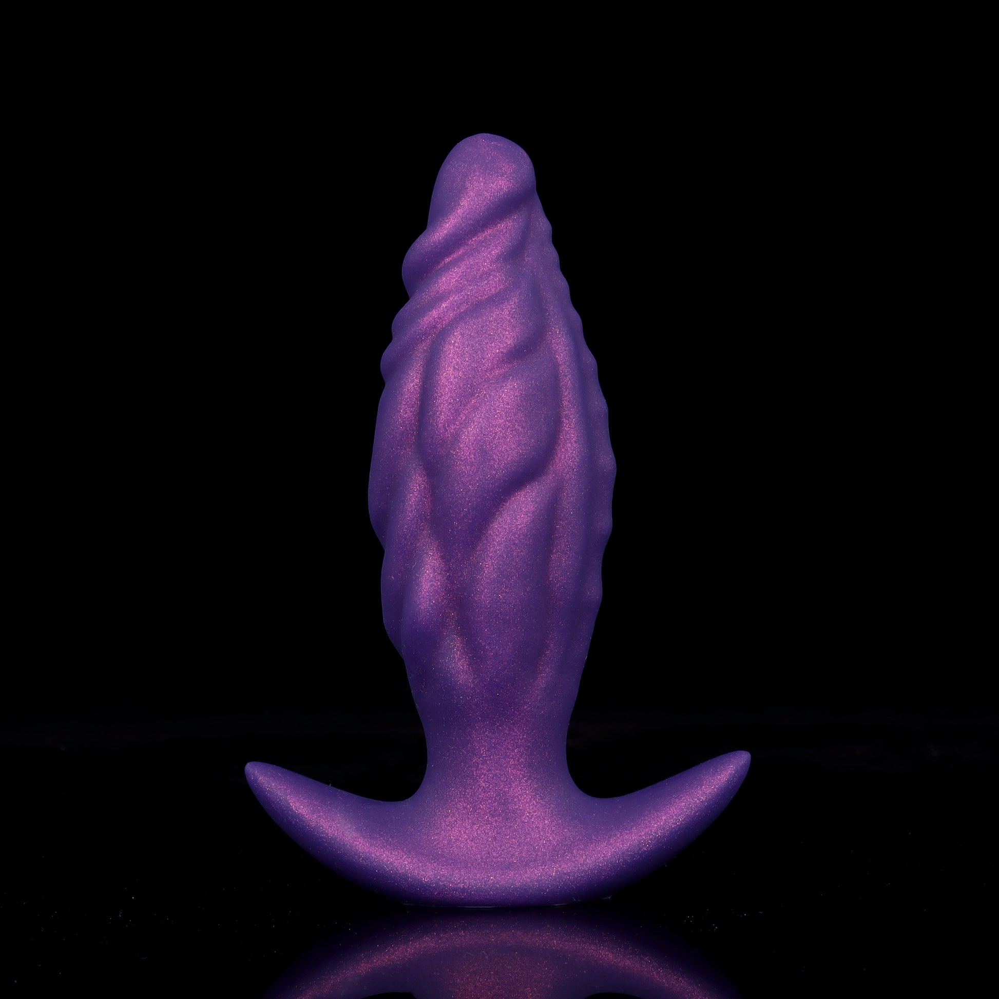 Front view of the royal purple textured anal plug in its uninflated state highlighting ergonomic ripple ridges and T-bar safety base.