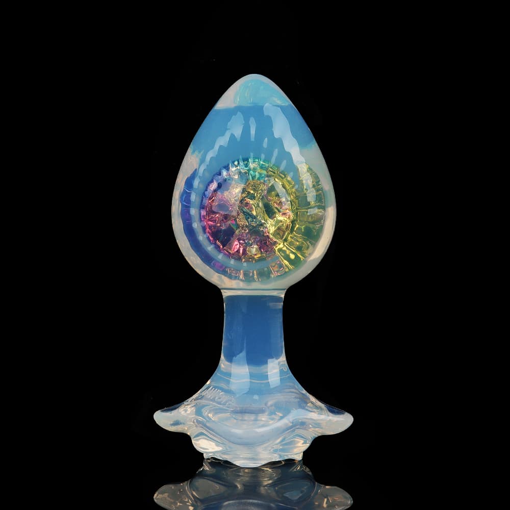 Front view of an elegant opal glass butt plug filled with colorful rainbow crackle glass inside.