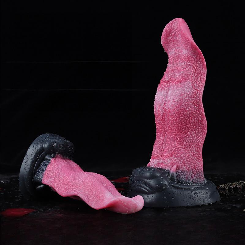 Side profile and front view of the two-toned fantasy beast tongue dildo set against a dark, wet surface.