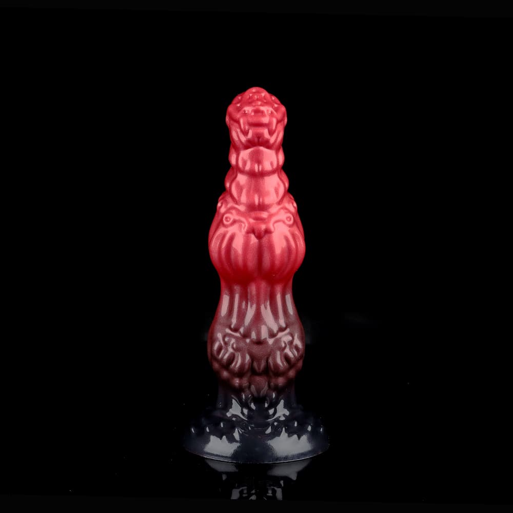 Front view of the premium fantasy monster dog knot dildo in a striking red and black ombre colorway, featuring detailed scales and a textured devilish reptile design against a solid black background.