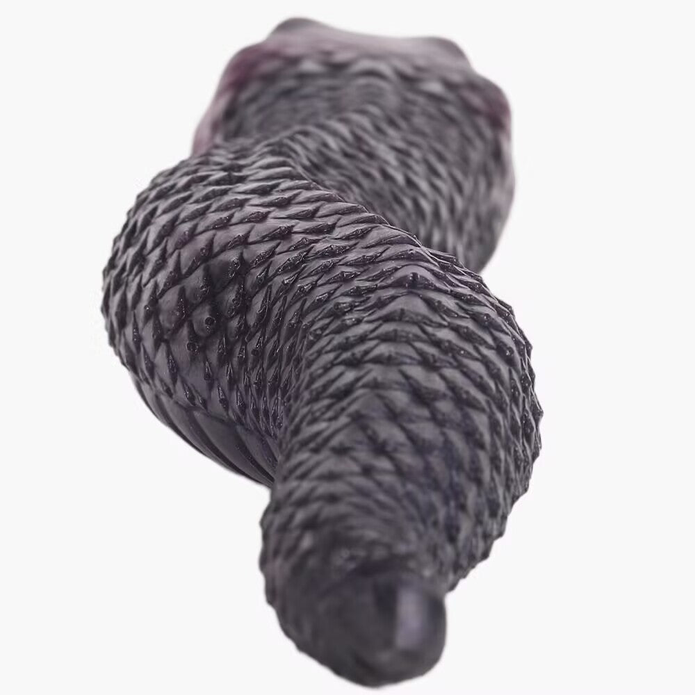 Close-up view of detailed snake scale texture along the silicone monster stroker