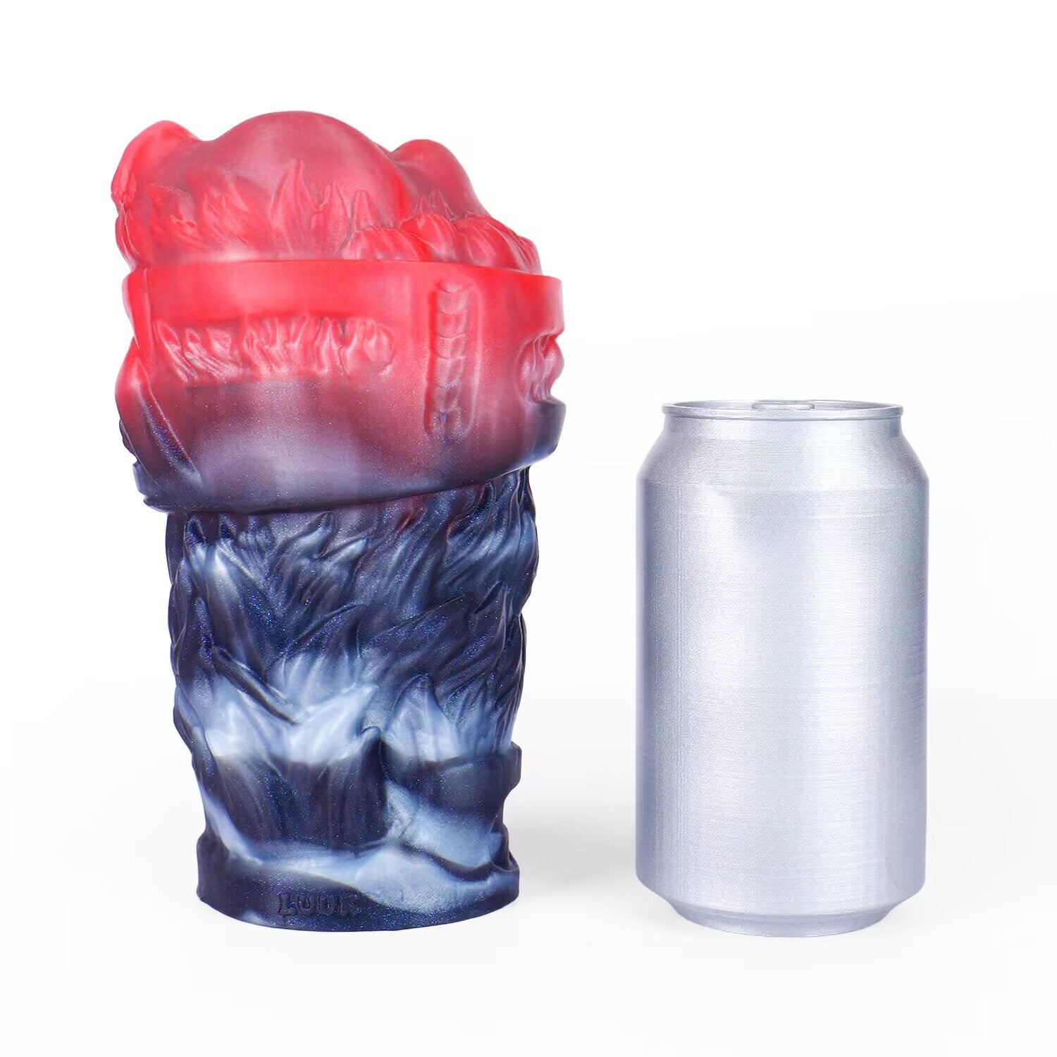 Size comparison view of Shadow Wolf Den silicone male masturbator standing next to a standard soda can.