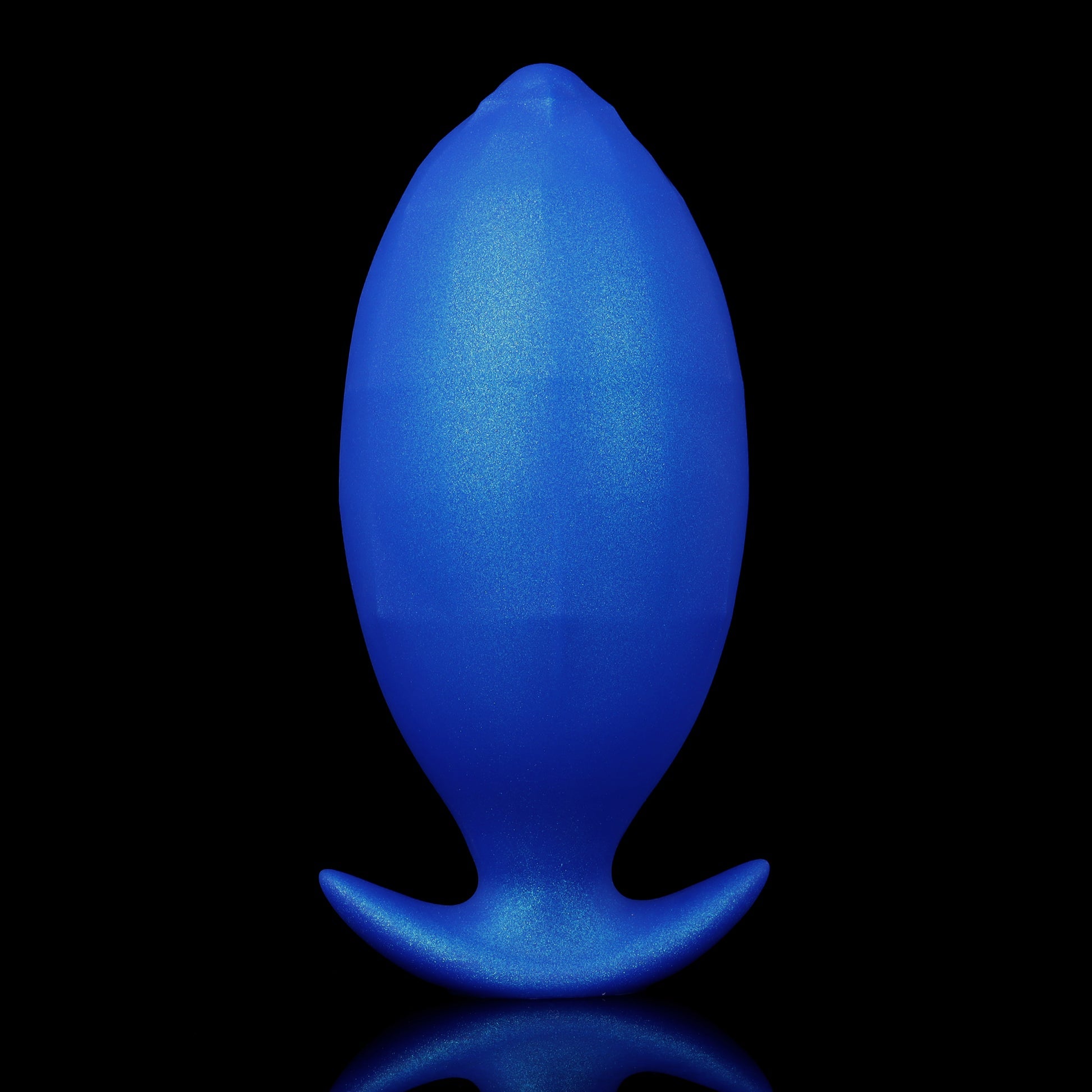 An egg-shaped smooth blue inflatable silicone plug standing upright, highlighting its seamless texture and wide crescent-style base for safe exploration.