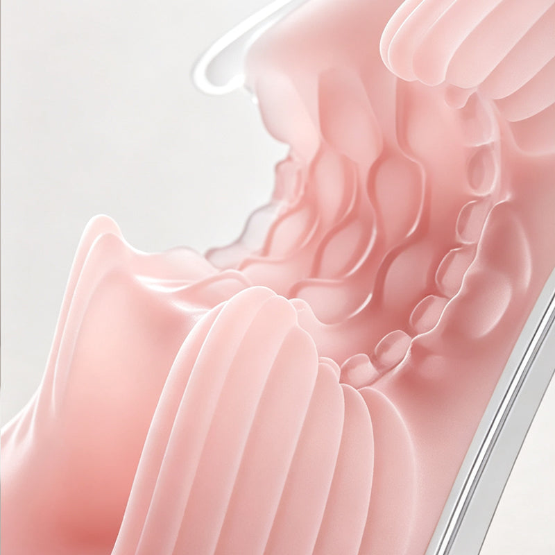 Macro detail of the ultra-soft pink TPE silicone sleeve showing organic wavy curves and raised inner texture ribs.