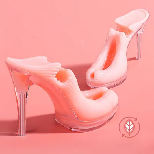 Two pink high-heel-shaped male masturbator toys with clear crystal stilettos on a pink background, showcasing alternative fetish design.