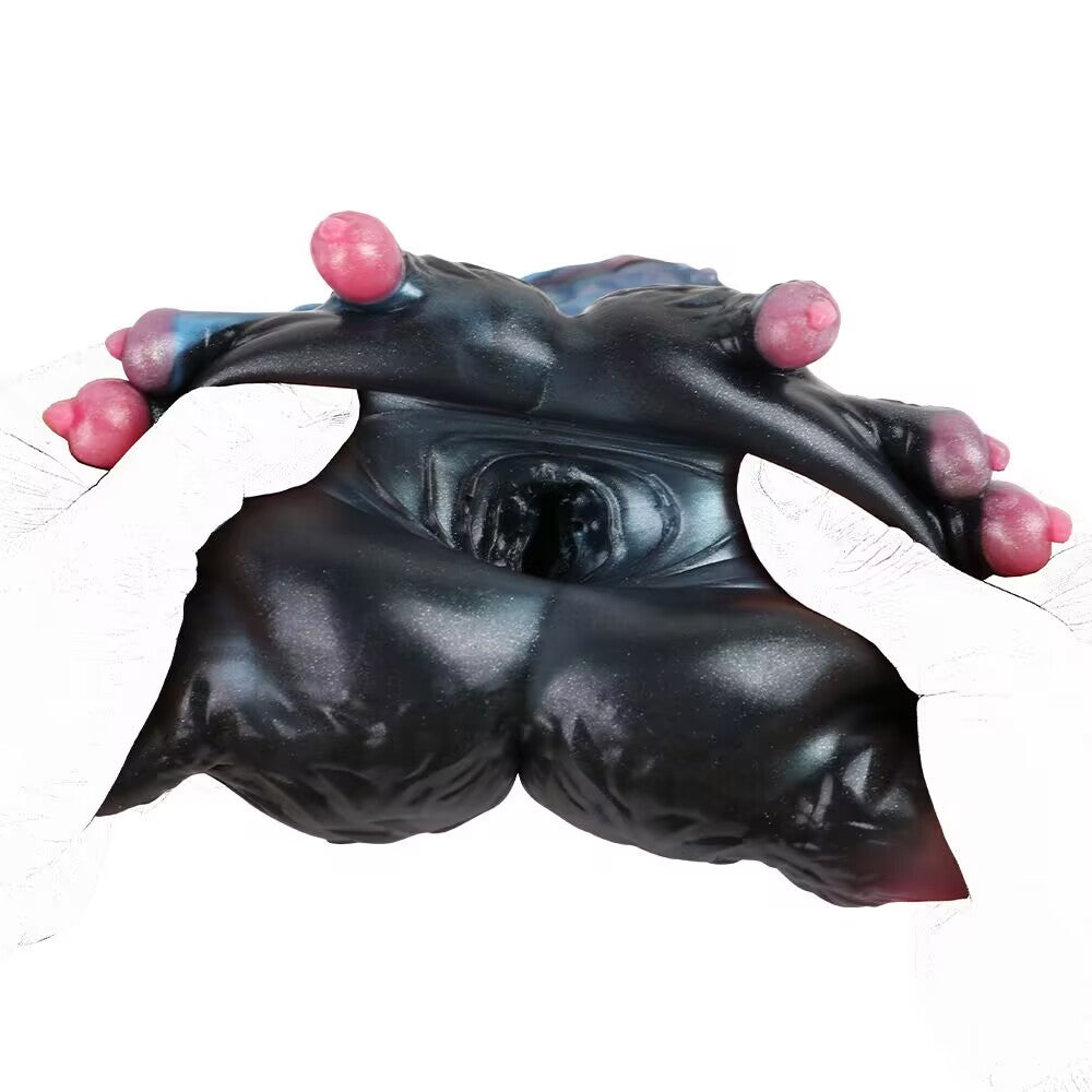 Entry orifice of stretchable monster masturbator pulled open to show inner cavity texture.
