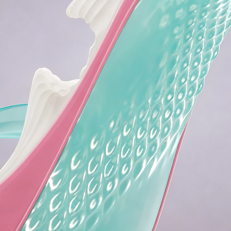 Close-up shot of non-slip teal textured bottom sole on high heel styled novel flesh toy