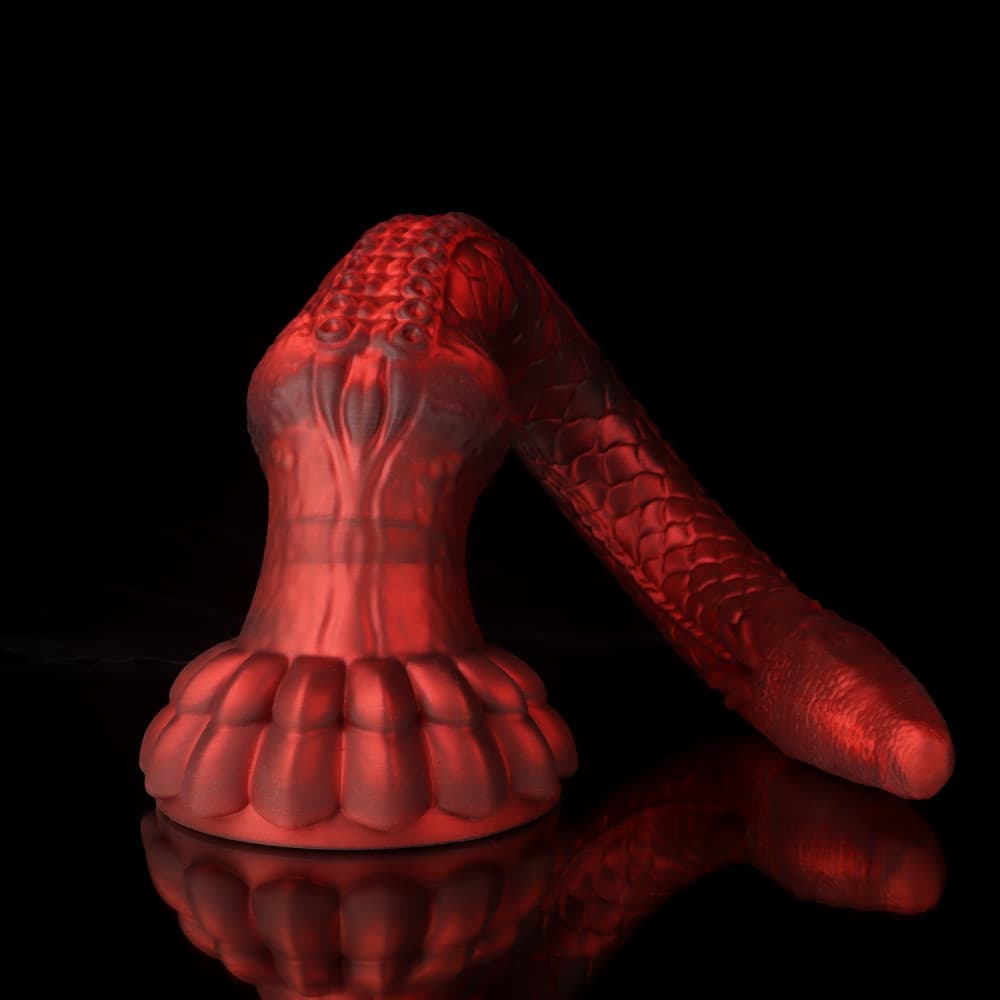Curved view of the crimson fantasy toy emphasizing the highly detailed dragon scale texture and tapered monster head.