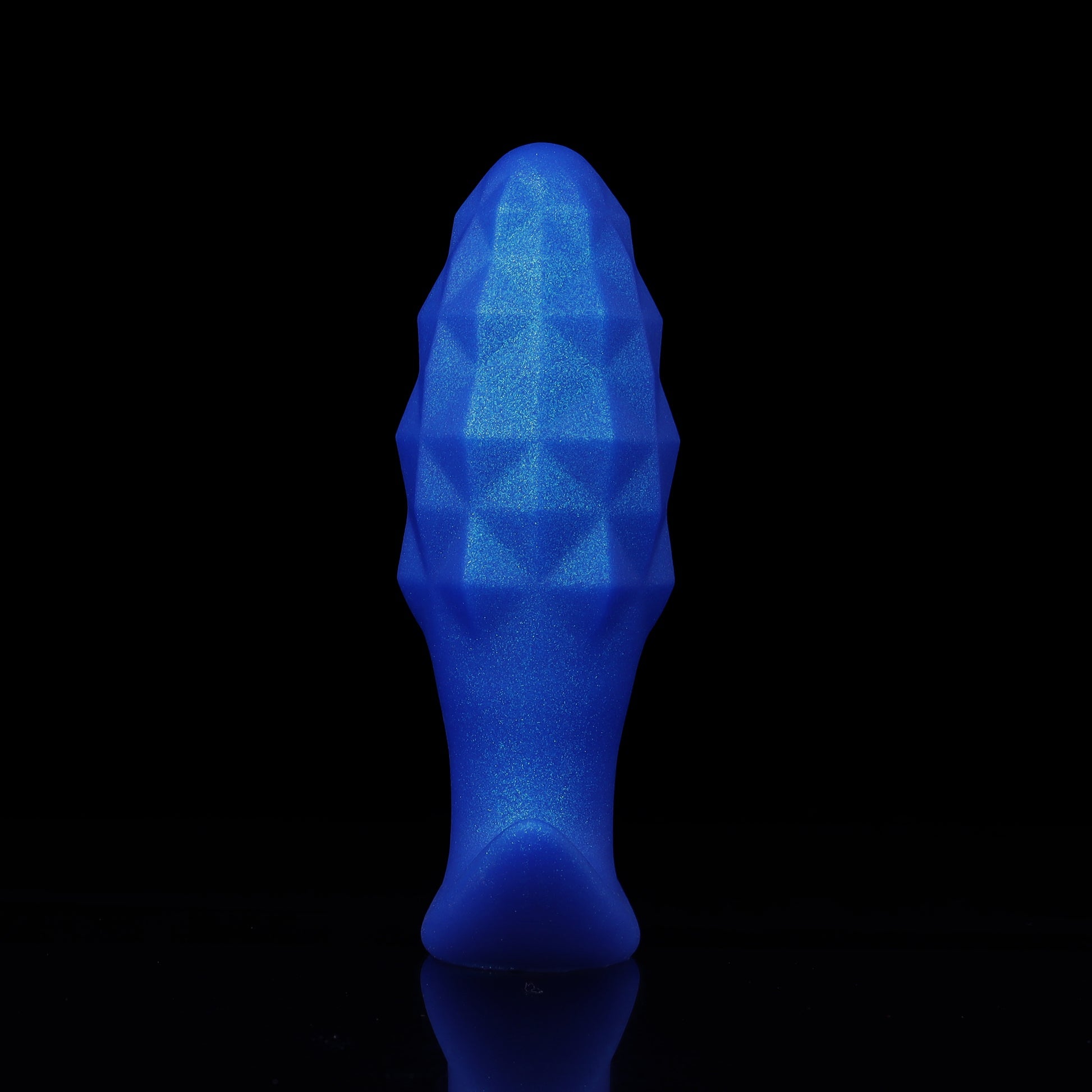 Side profile of a premium blue expandable silicone plug showing its tapered shape, diamond cut pattern, and ergonomic flared base.