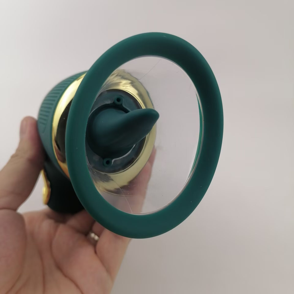 Front view looking into the clear suction chamber and central silicone licking element.