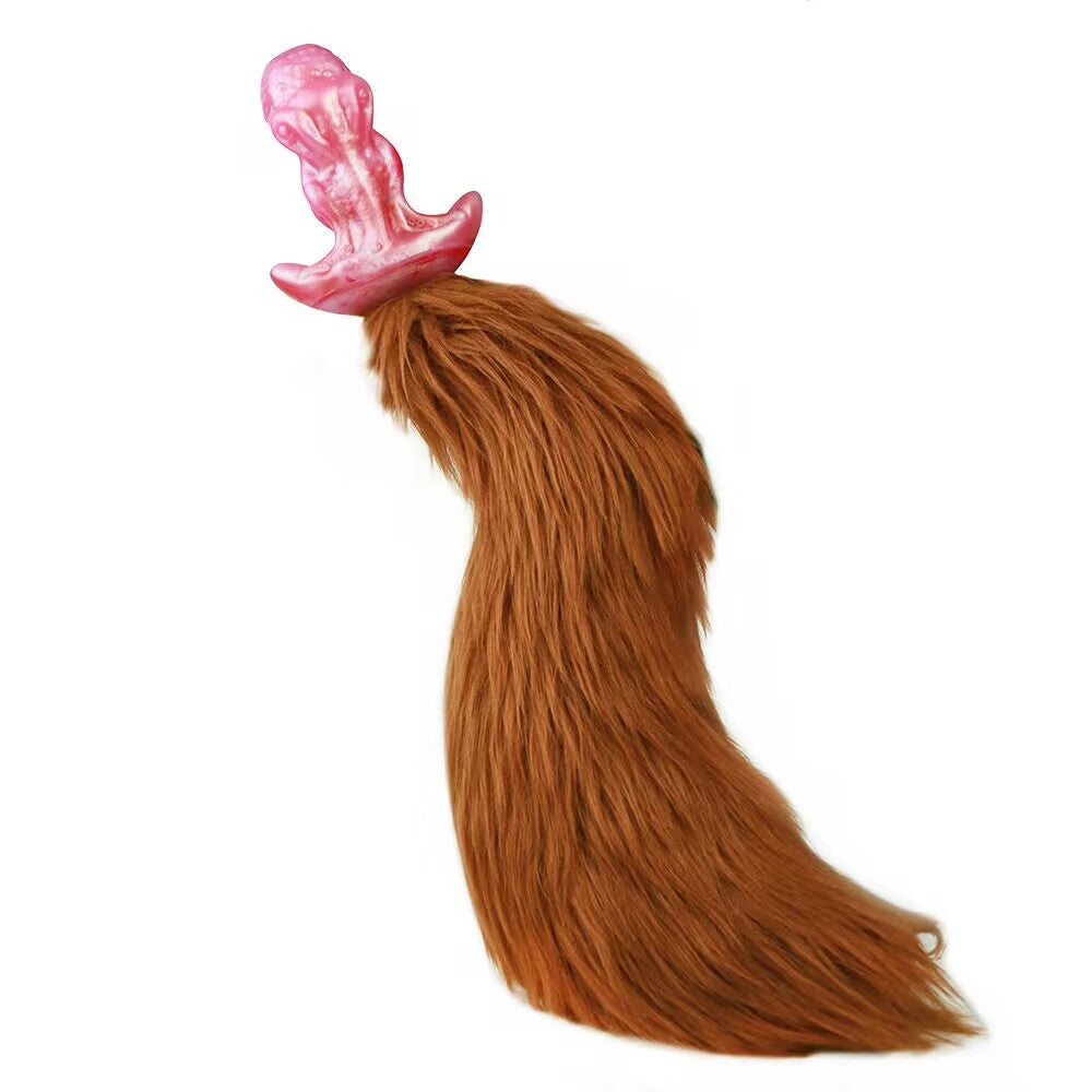 Side profile showing the pink octopus tentacle dildo fitted on body using the black adjustable strap-on harness.