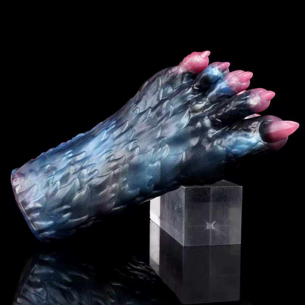Eldritch beast claw male stroker propped on a clear stand, emphasizing its heavy weighted design and premium adult novelty aesthetics.